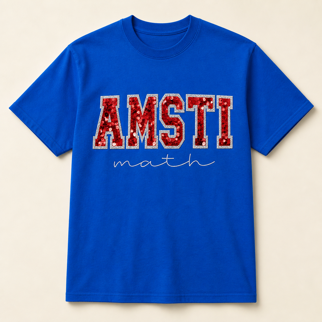 Royal blue AMSTI math shirt with red sequins and silver glitter