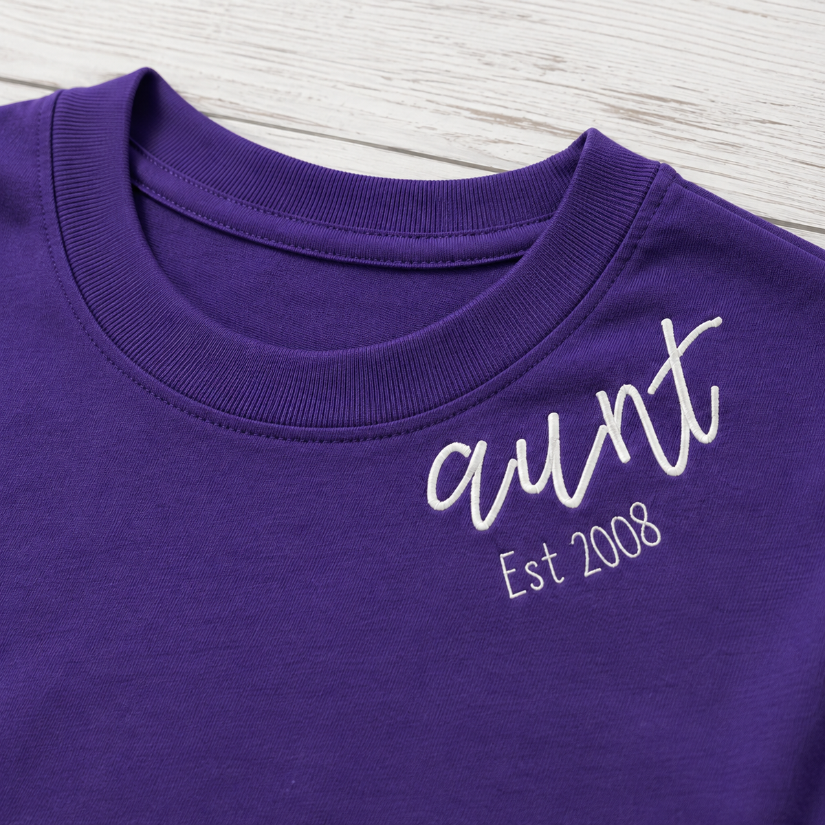 Established Script & Sleeve Names Long-Sleeve Tee. Curved-neck embroidery. Shown in: Gildan • Purple.