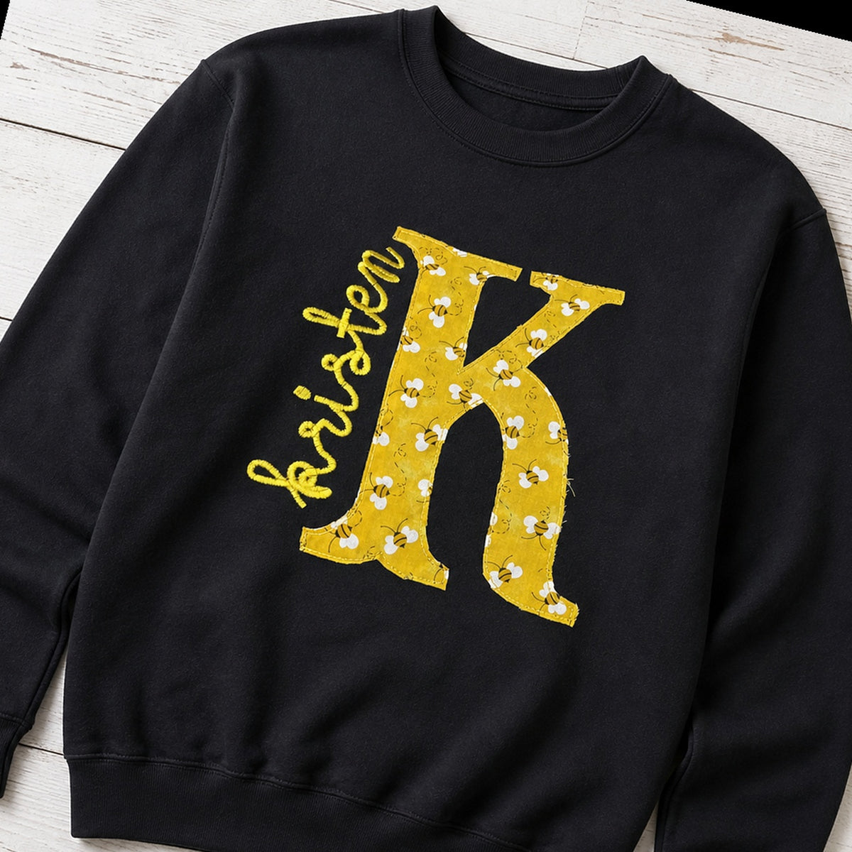 bee initial name crewneck styled flat lay