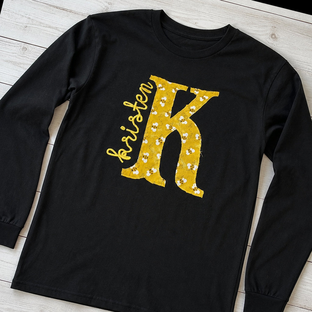 bee initial name long sleeve styled flat lay