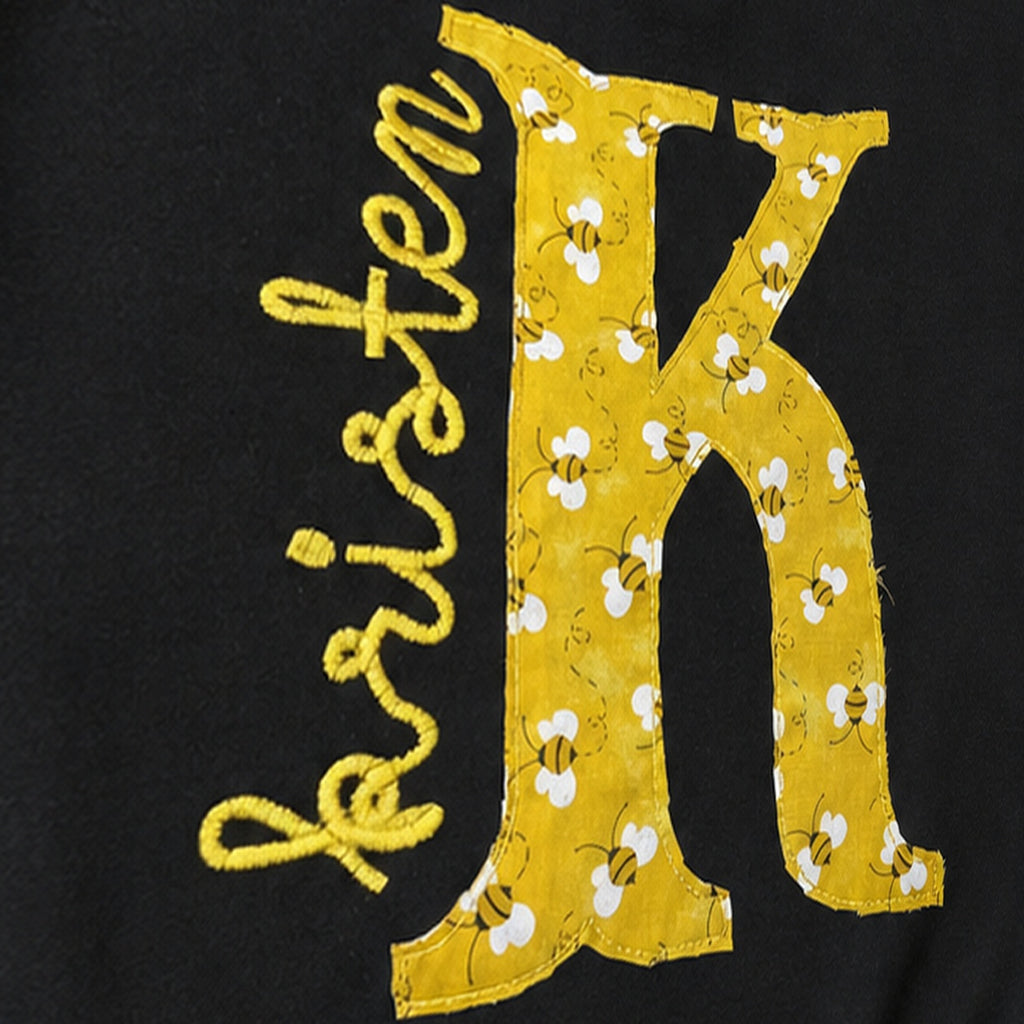bee initial name quarter zip embroidery close-up