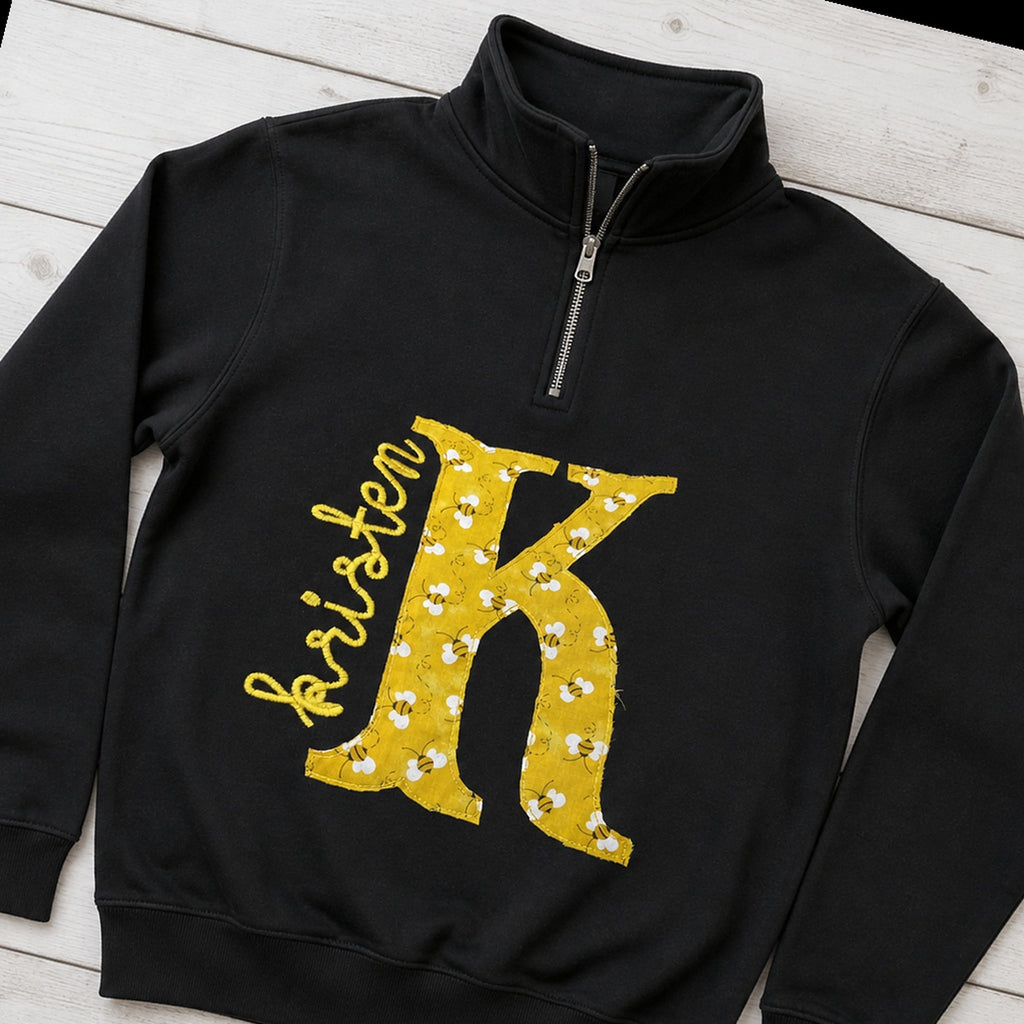 bee initial name quarter zip styled flat lay
