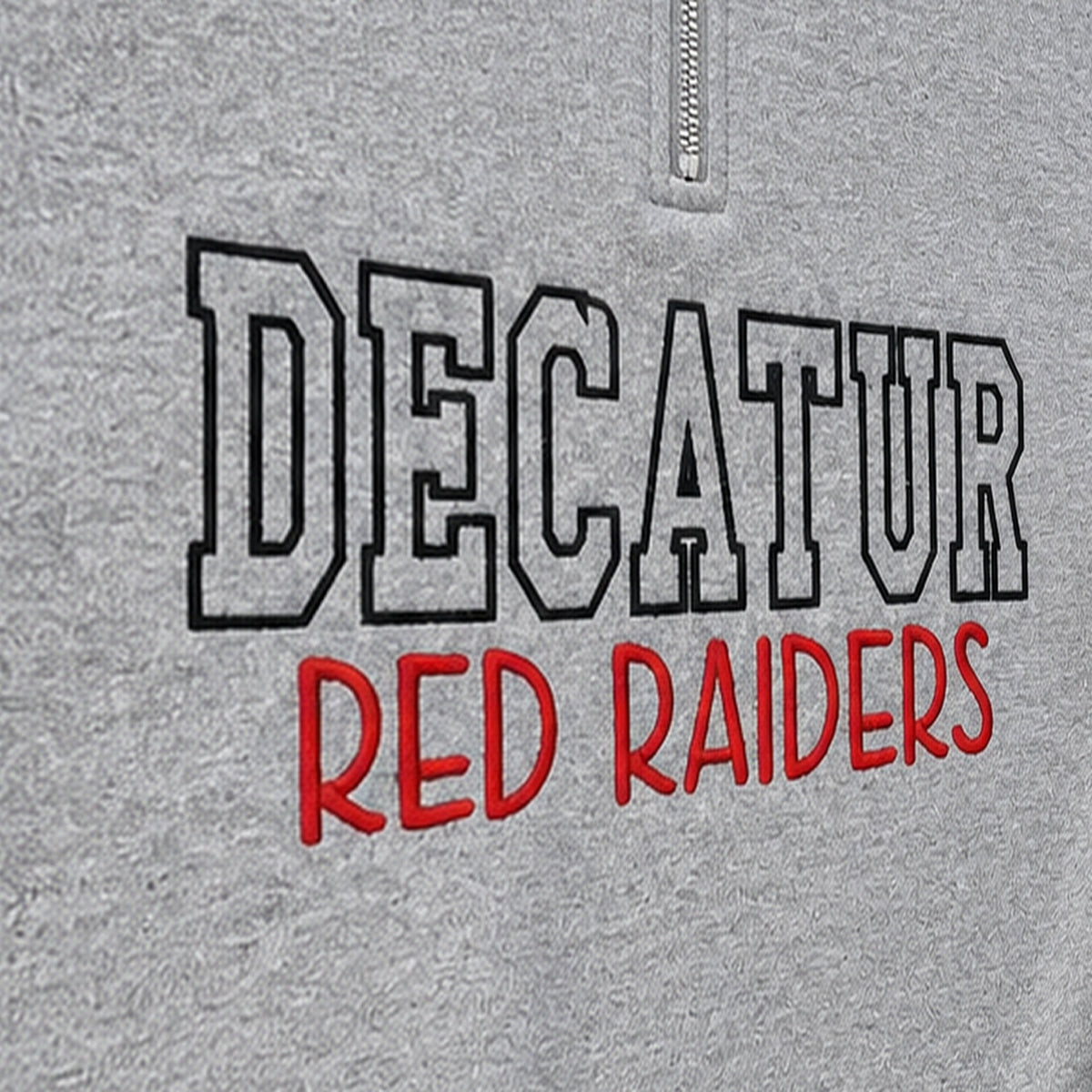 block outline team name quarter zip embroidery close-up