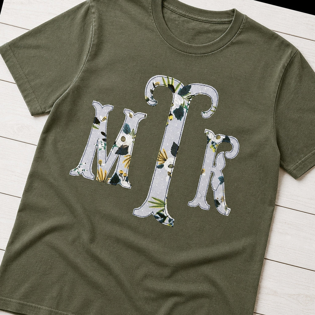 Botanical floral serif monogram shirt folded flat lay