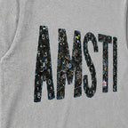 Close-up of the embroidered design on a custom chalkboard applique long sleeve shirt