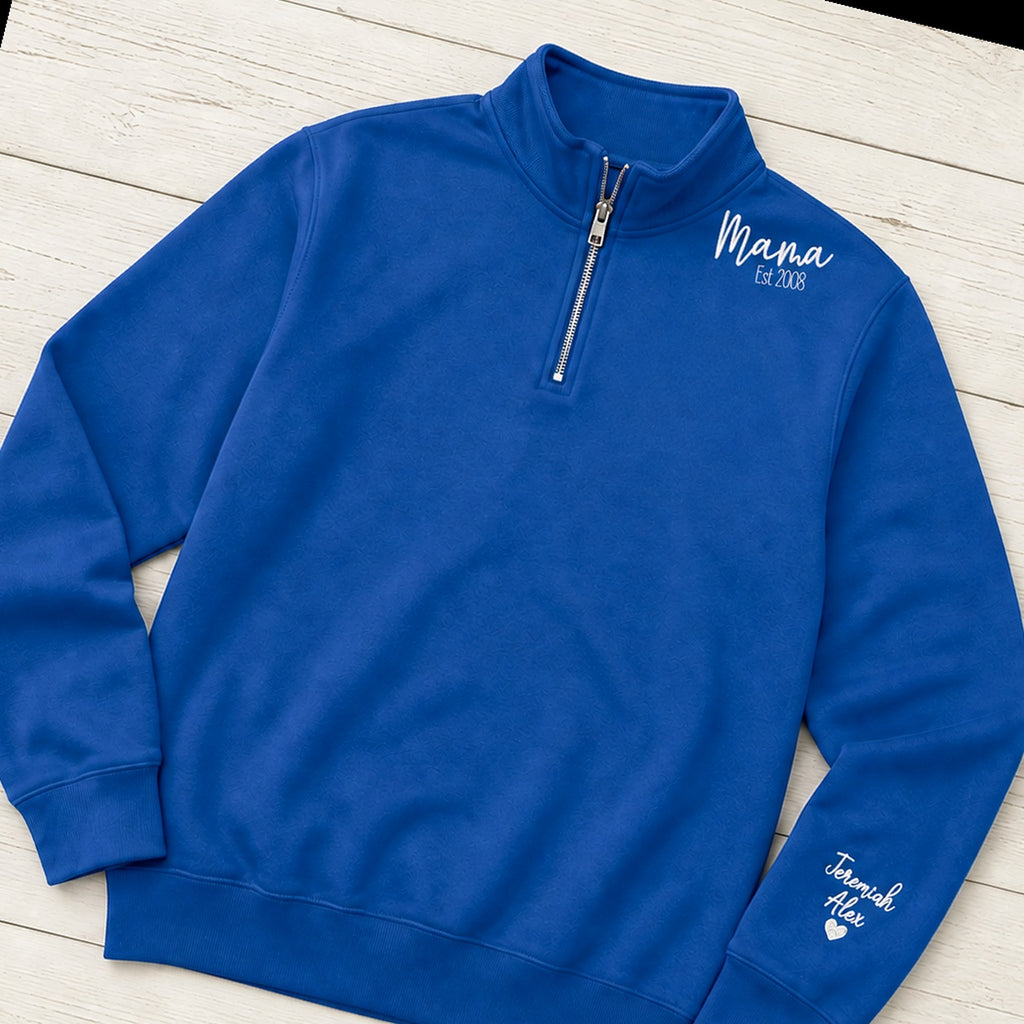 Mama established quarter zip with sleeve names folded flat lay