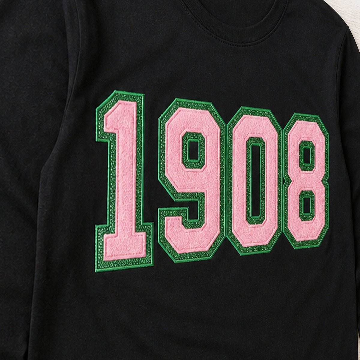 faux chenille glitter long sleeve embroidery close-up