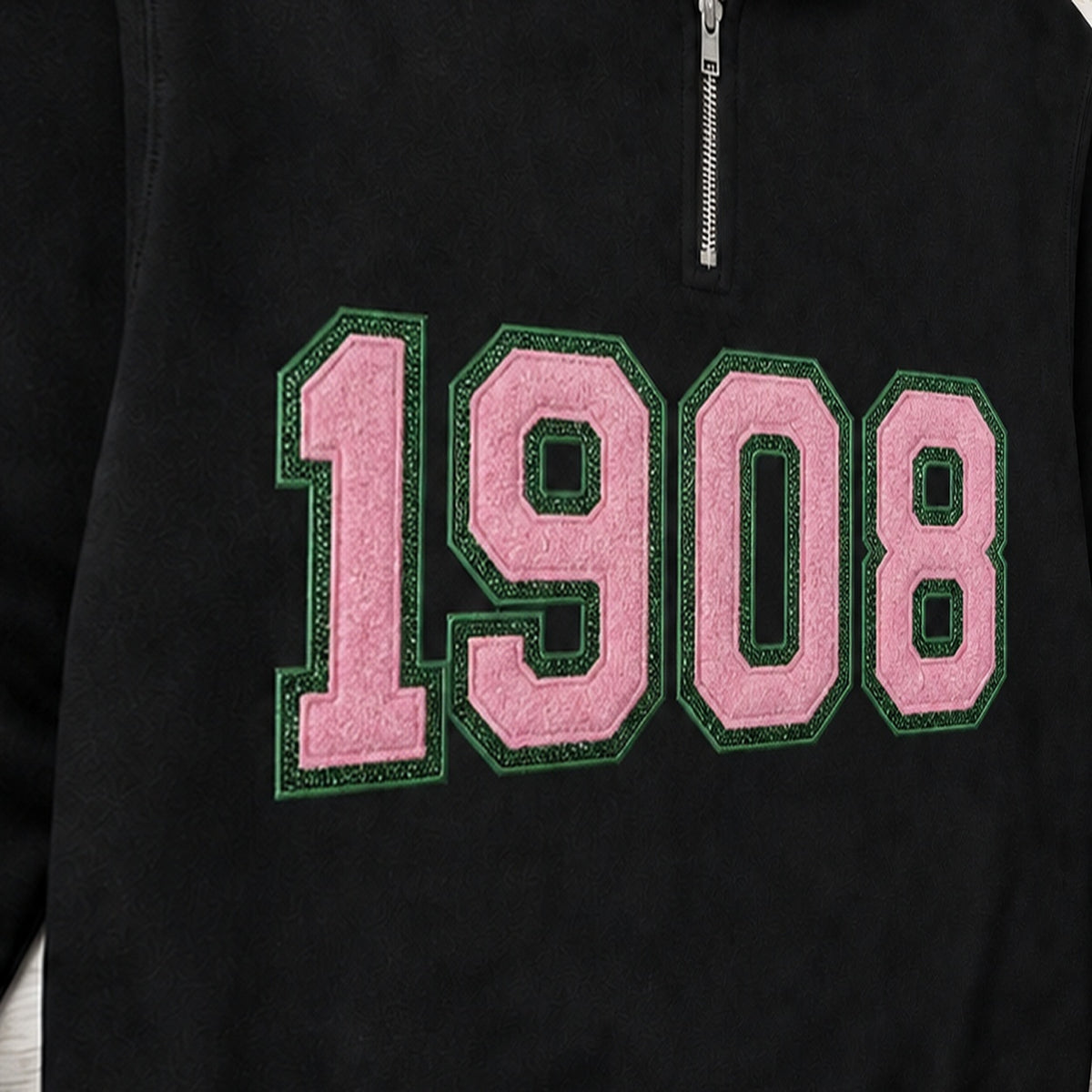 Close-up of the embroidered design on a 1908 faux chenille glitter quarter zip pullover