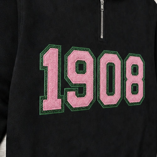 Close-up of the embroidered design on a 1908 faux chenille glitter quarter zip pullover