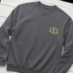 gold script pocket monogram crewneck styled flat lay