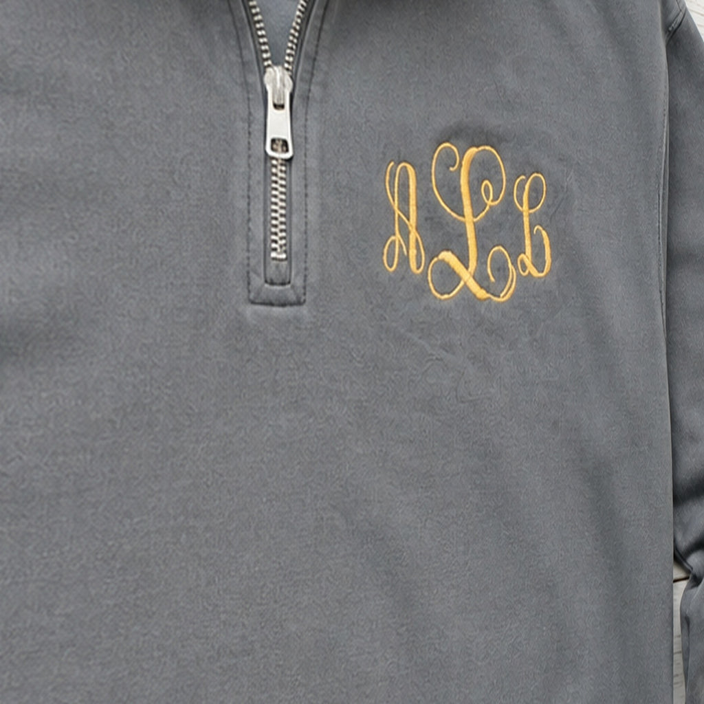 gold script pocket monogram quarter zip embroidery close-up