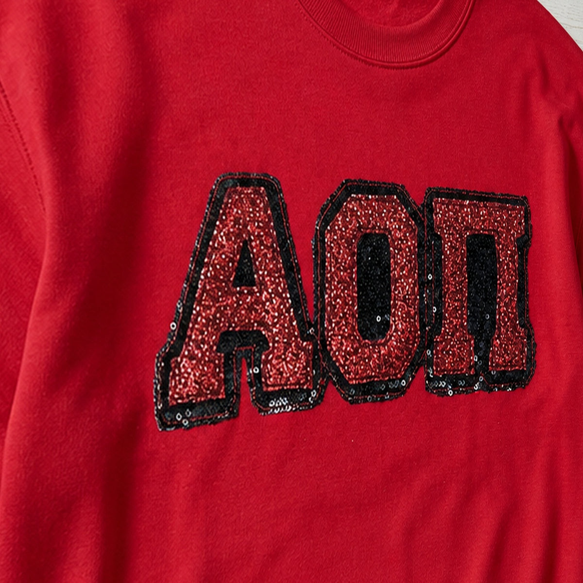 greek sequin applique crewneck embroidery close-up