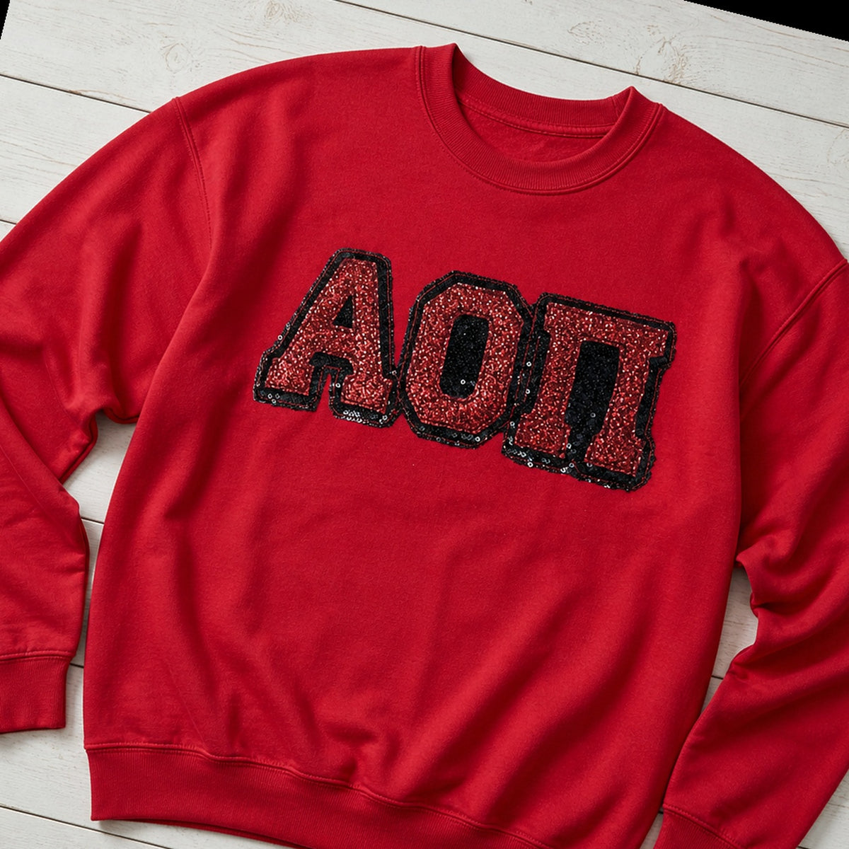 greek sequin applique crewneck styled flat lay