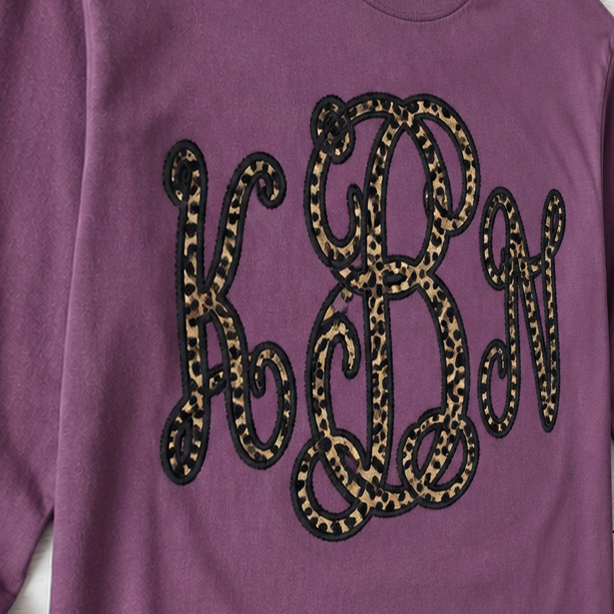 leopard vine monogram long sleeve embroidery close-up