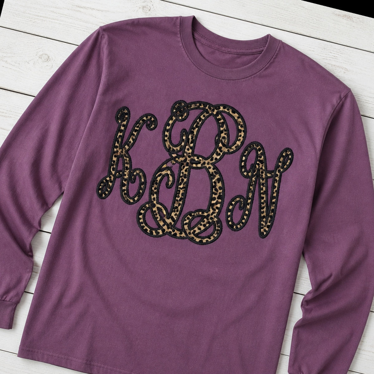 leopard vine monogram long sleeve styled flat lay
