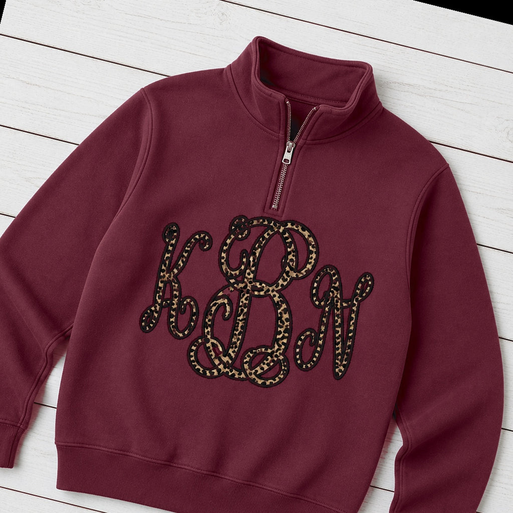 Custom leopard vine monogram quarter zip pullover folded flat lay
