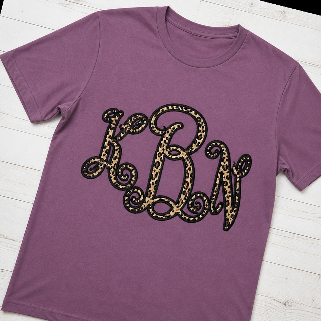 leopard vine monogram short sleeve styled flat lay