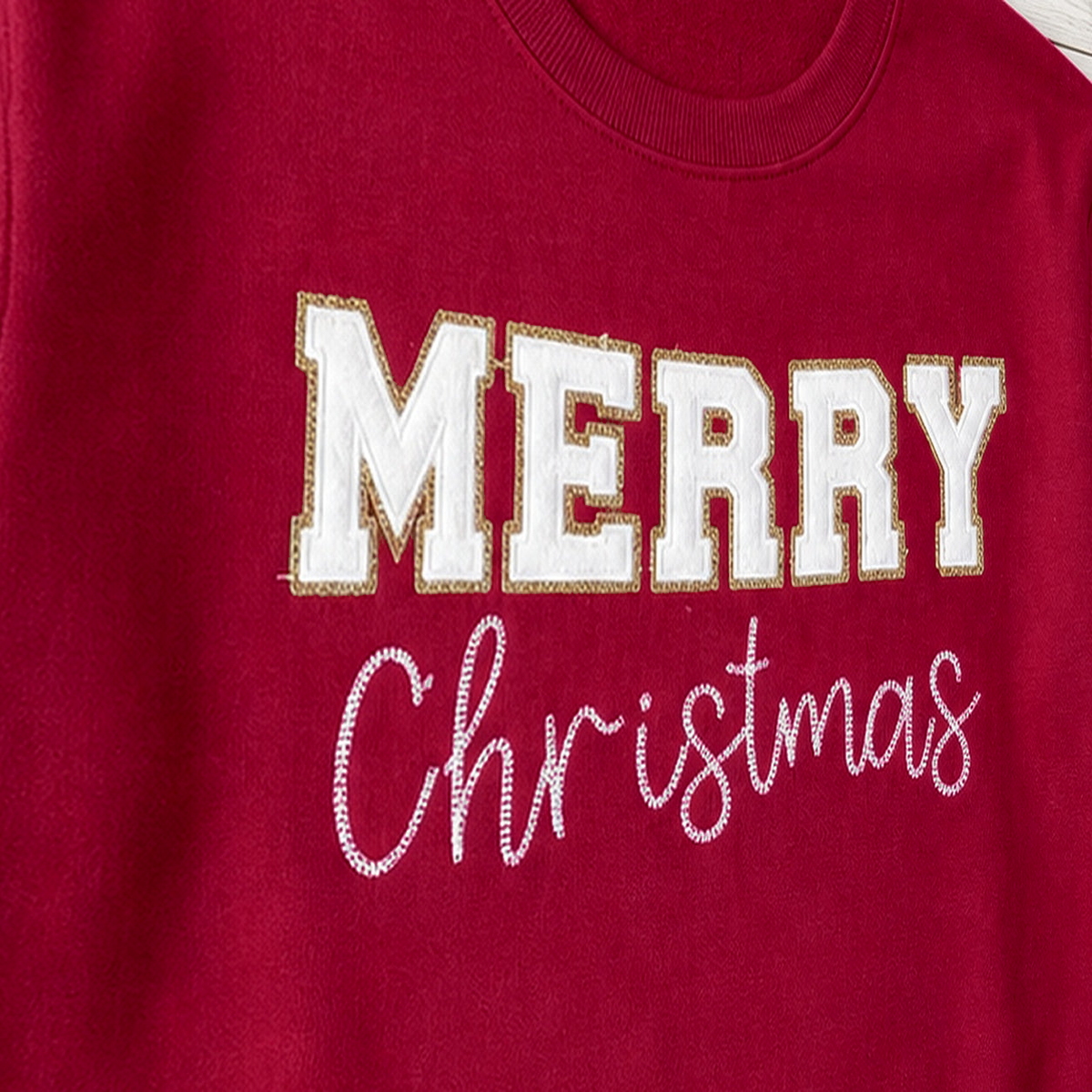 White & Gold Merry Christmas Sweatshirt. Shown in: Gildan • Cardinal Red.