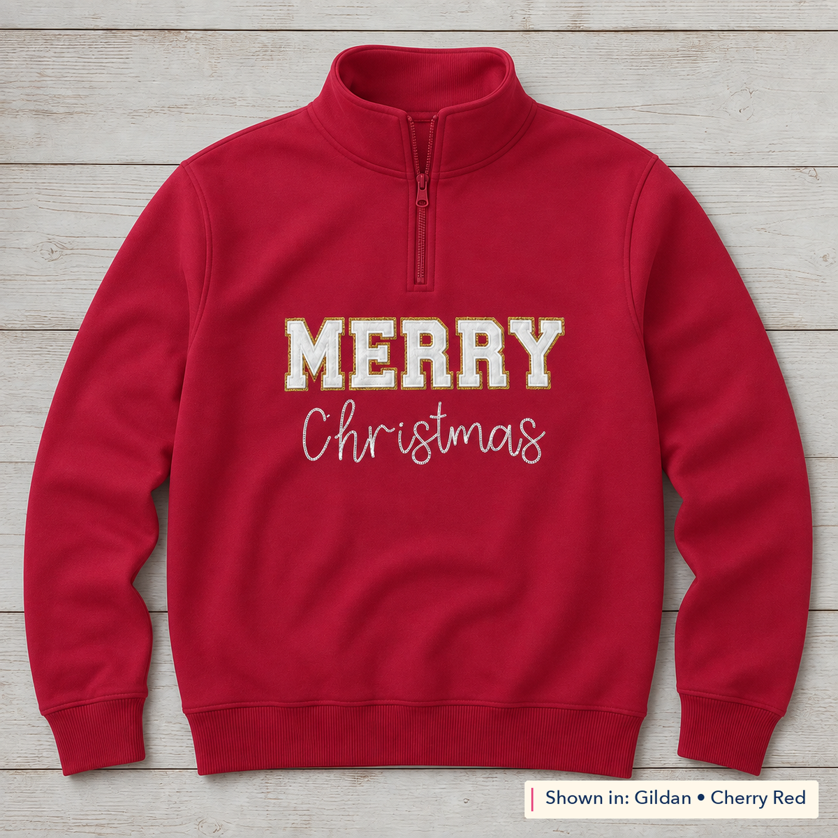 White and gold Merry Christmas design on Gildan 18810 Cherry Red quarter-zip; shown in Gildan Cherry Red