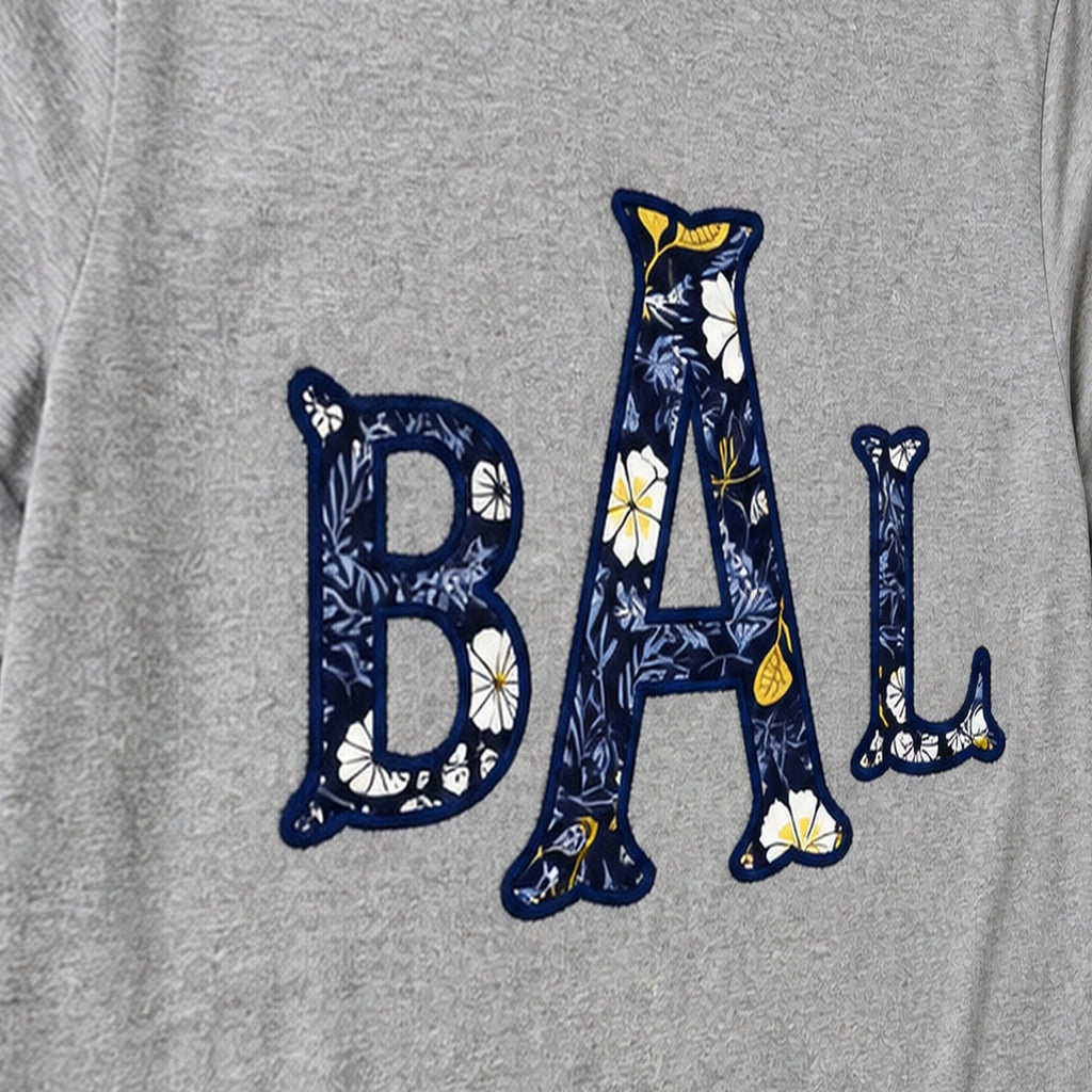 navy floral block monogram long sleeve embroidery close-up