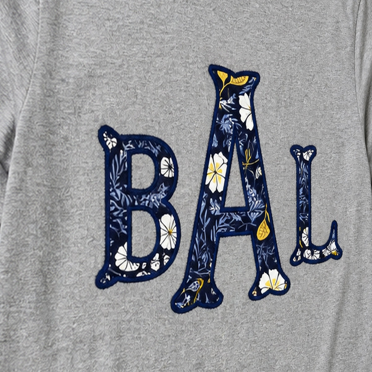 navy floral block monogram long sleeve embroidery close-up