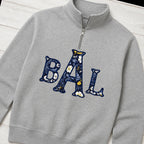 navy floral block monogram quarter zip styled flat lay