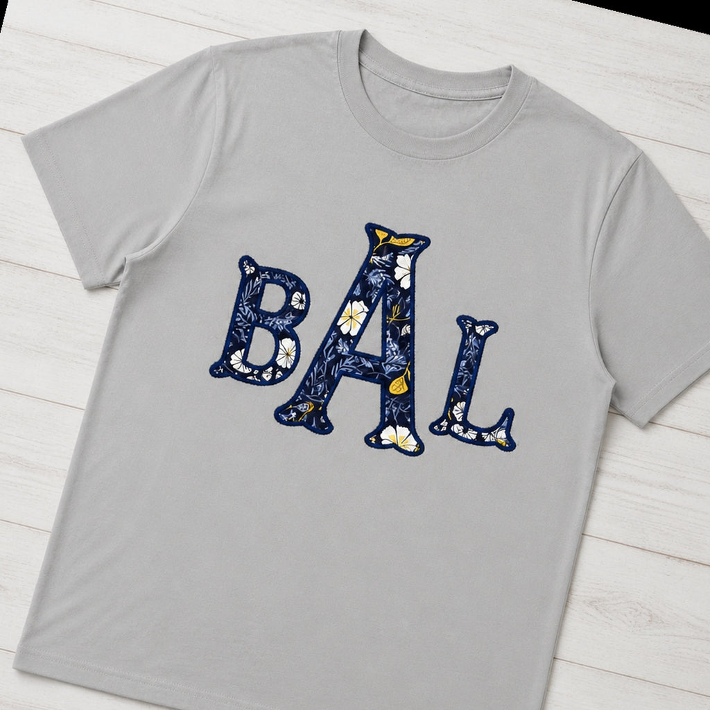 navy floral block monogram short sleeve styled flat lay