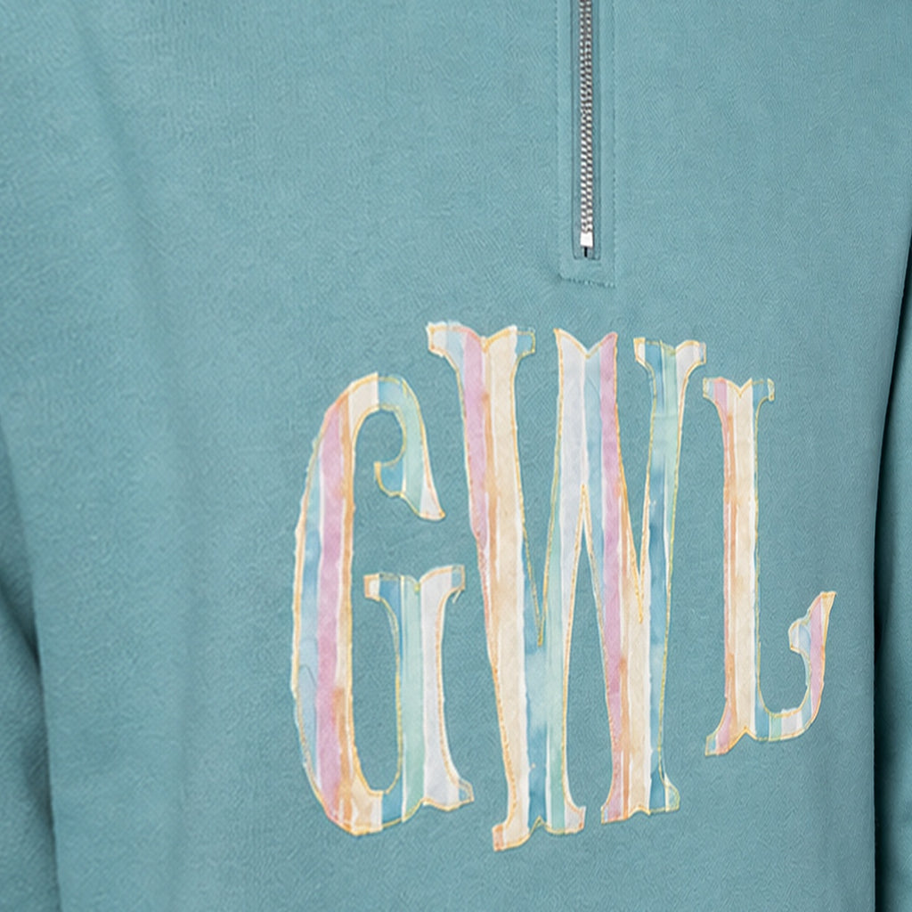pastel stripe serif monogram quarter zip embroidery close-up