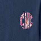 Close-up of the embroidered design on a custom floral chest monogram crewneck sweatshirt