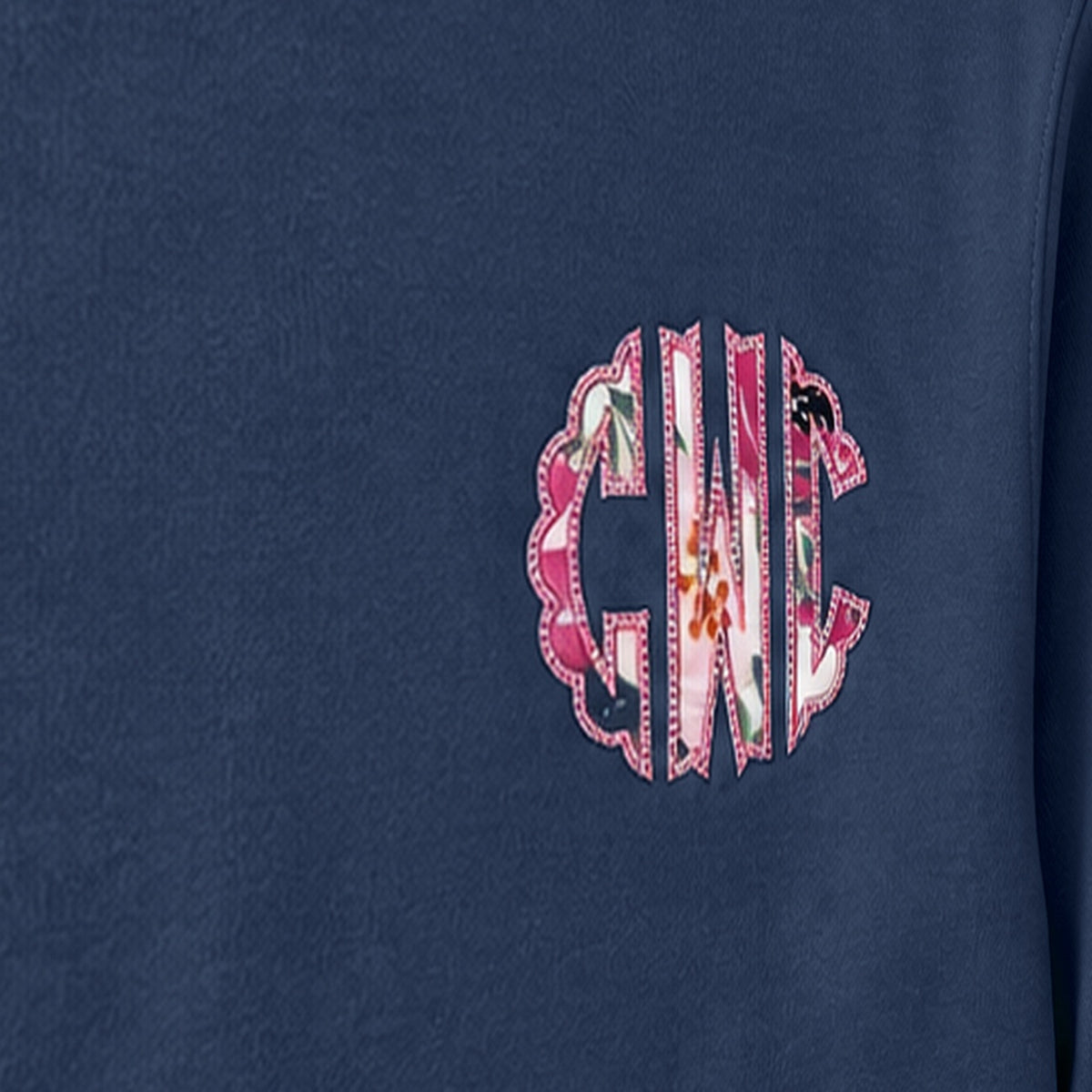 Close-up of the embroidered design on a custom floral chest monogram crewneck sweatshirt