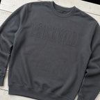priceville tonal outline crewneck styled flat lay