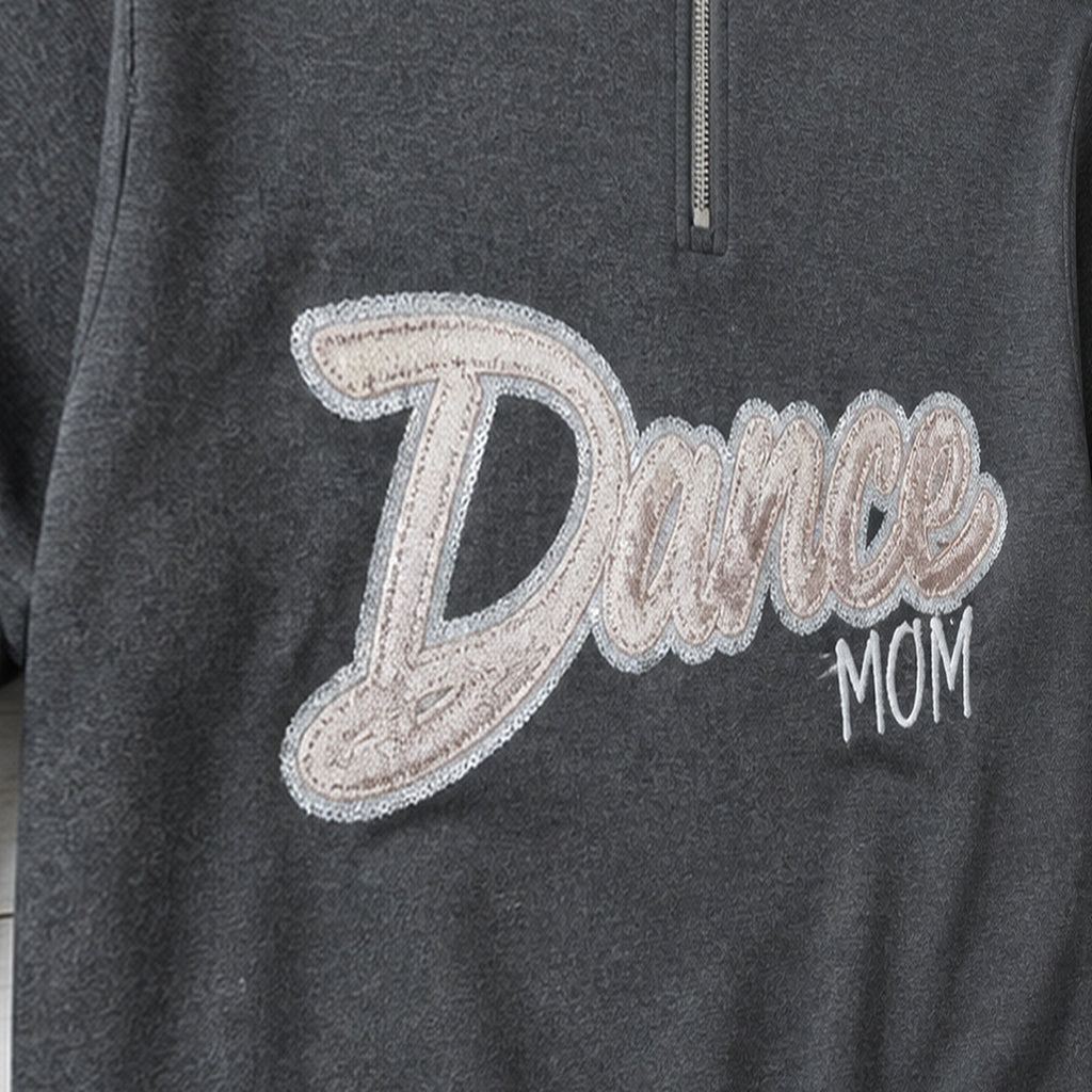 script glitter sequin quarter zip embroidery close-up