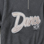 script glitter sequin quarter zip embroidery close-up