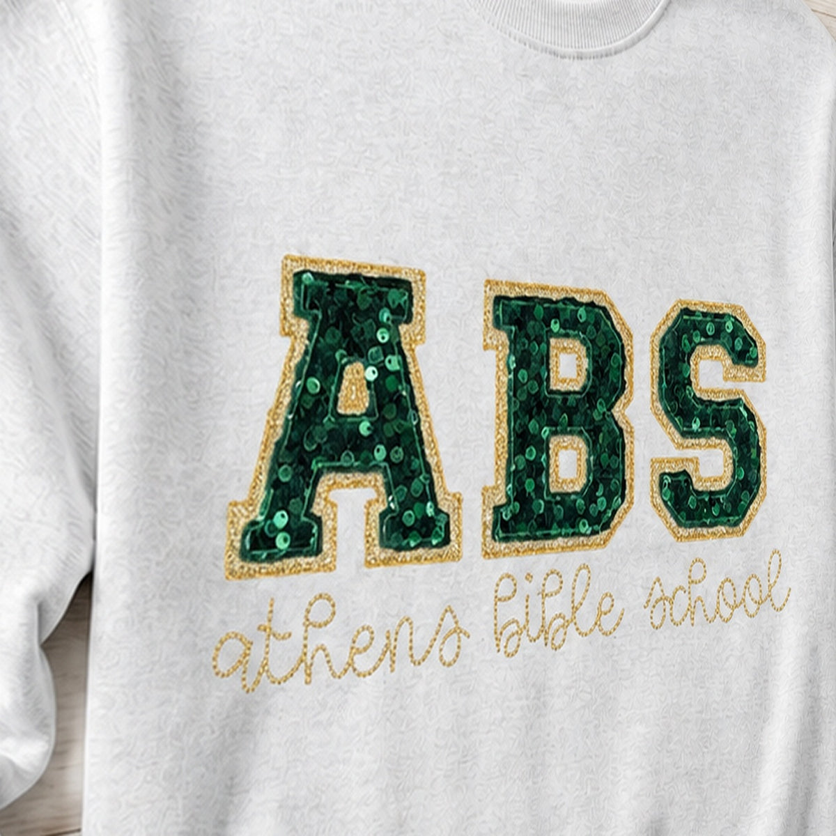 Close-up of the embroidered design on a custom sequin varsity crewneck sweatshirt
