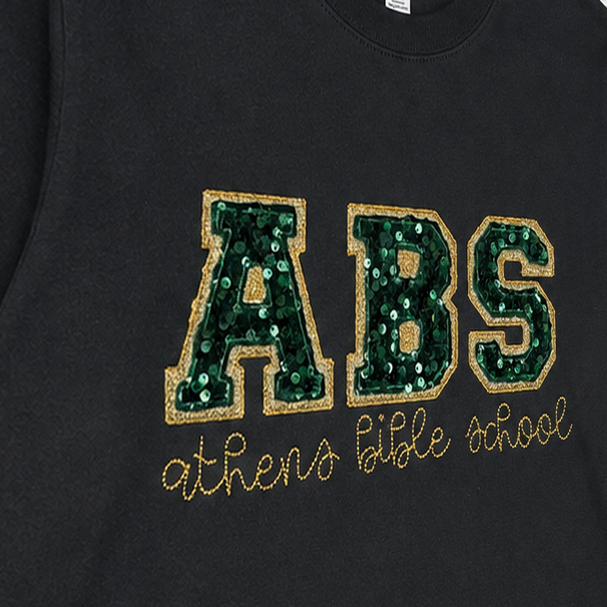 Close-up of the embroidered design on a custom sequin varsity long sleeve shirt