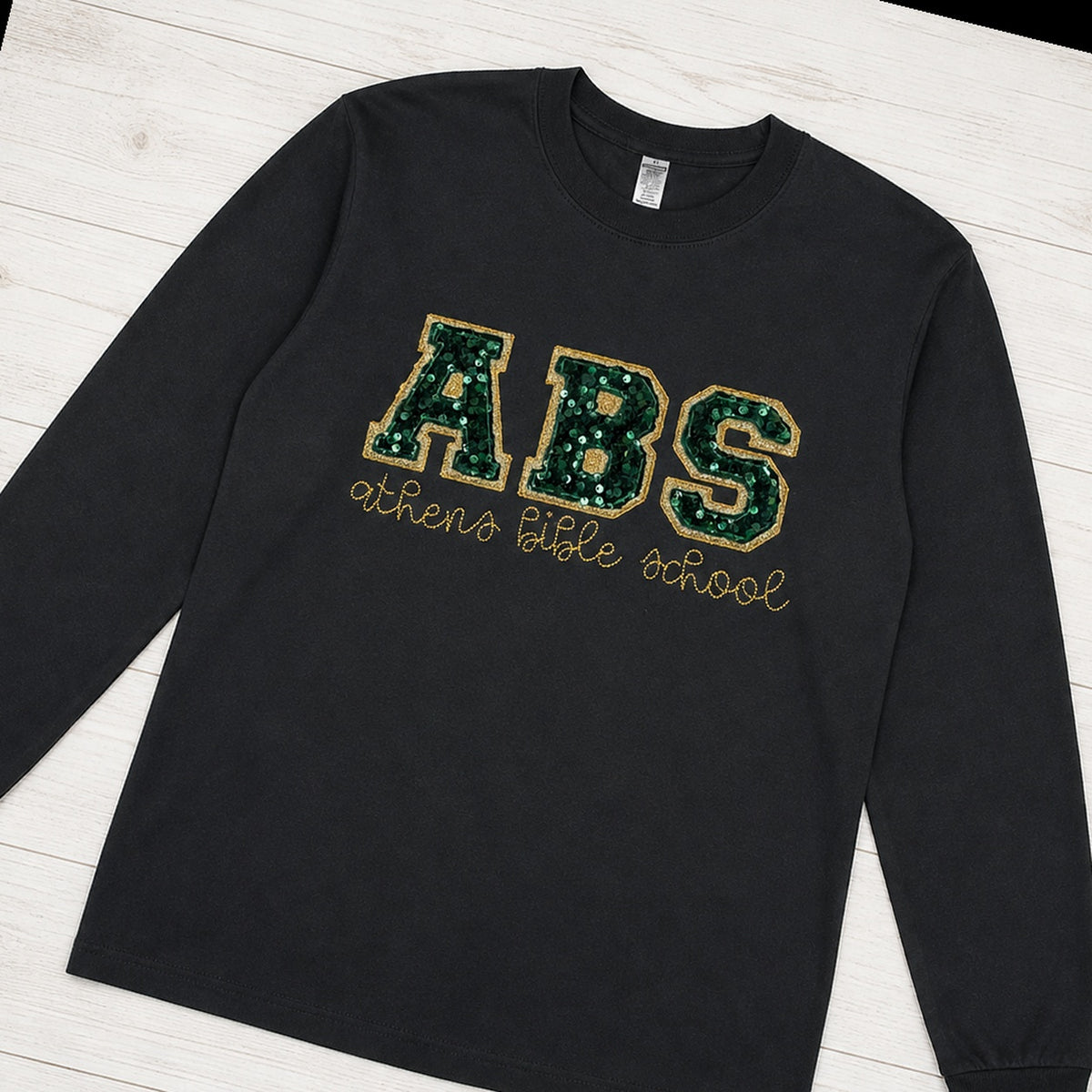 Custom sequin varsity long sleeve shirt folded flat lay