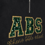 Close-up of the embroidered design on a custom sequin varsity quarter zip pullover