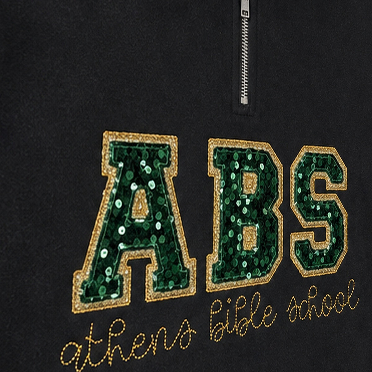 Close-up of the embroidered design on a custom sequin varsity quarter zip pullover