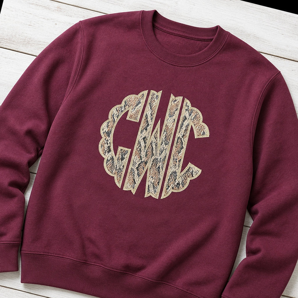 snakeskin scallop monogram crewneck styled flat lay