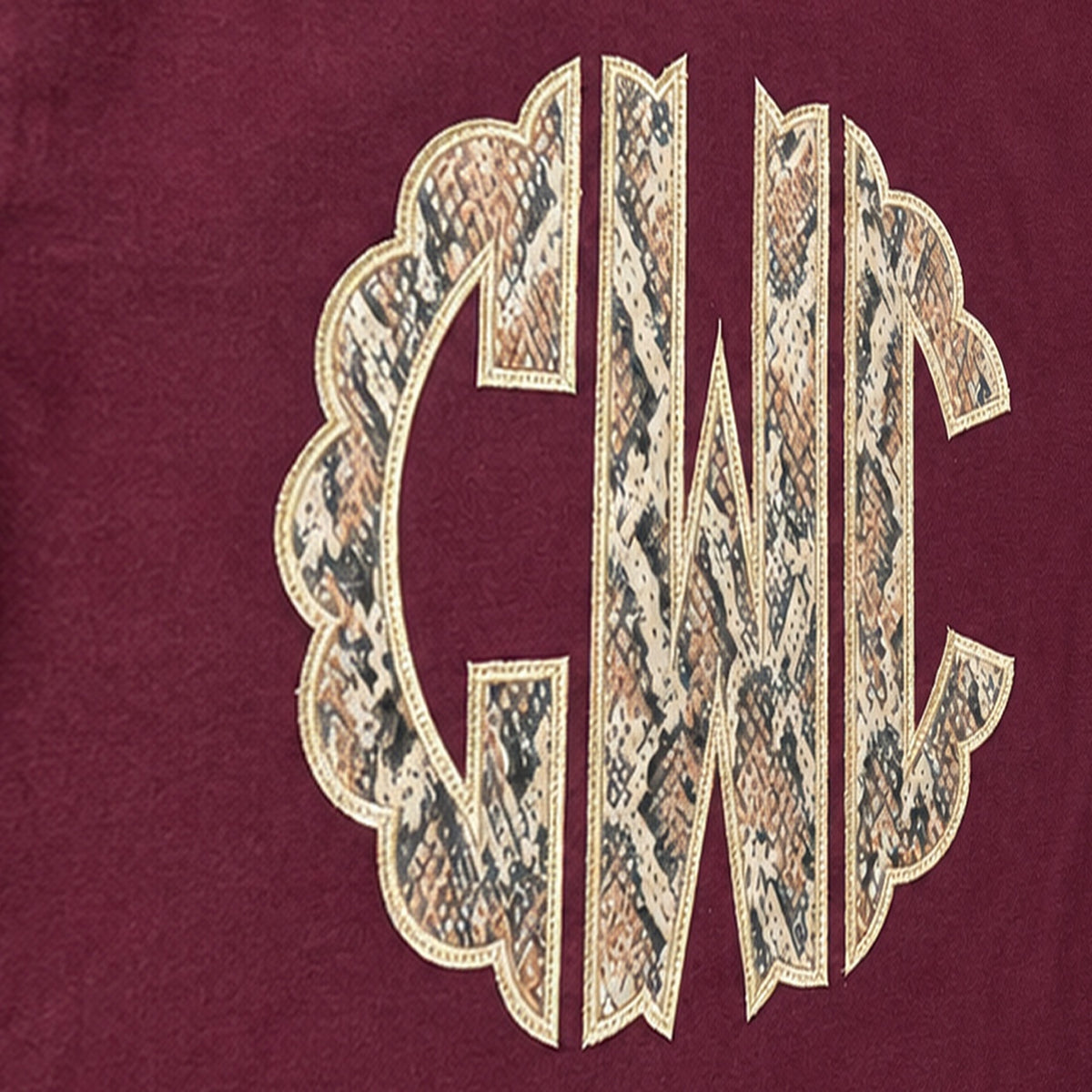 snakeskin scallop monogram long sleeve embroidery close-up