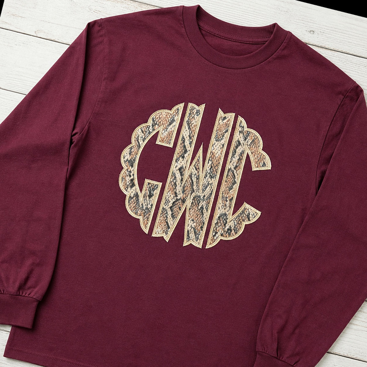 snakeskin scallop monogram long sleeve styled flat lay