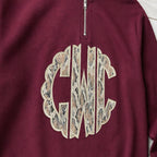 snakeskin scallop monogram quarter zip embroidery close-up