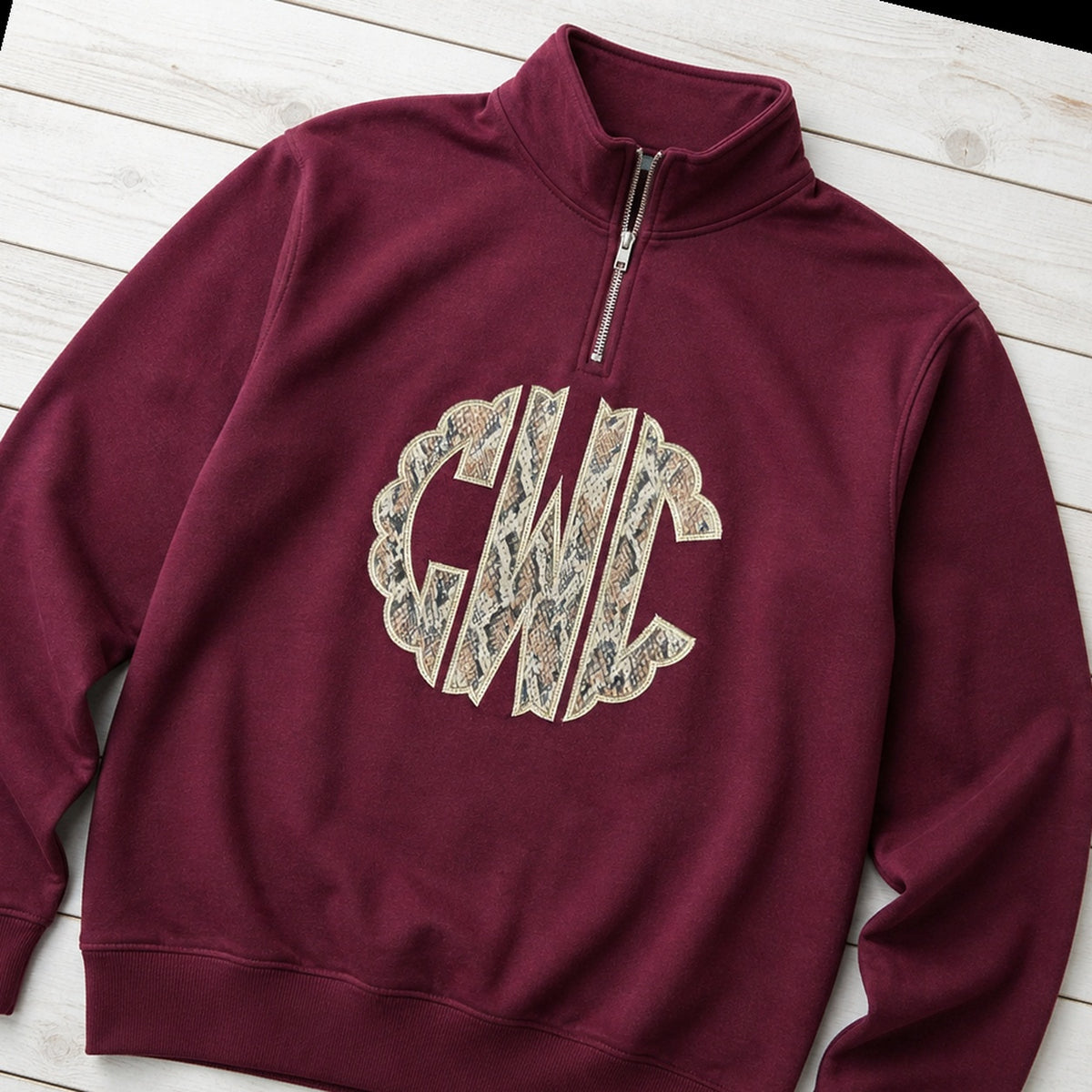 snakeskin scallop monogram quarter zip styled flat lay