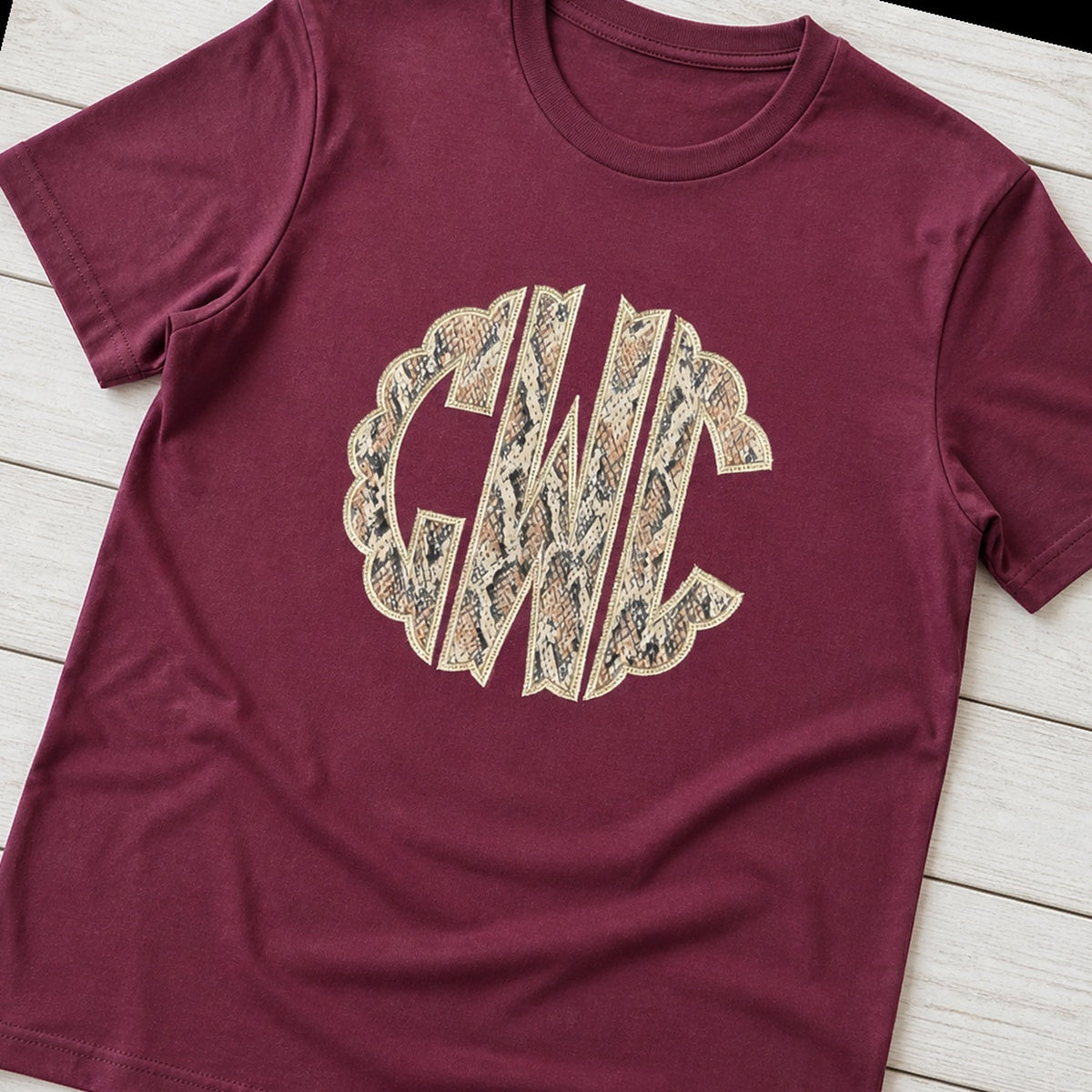 snakeskin scallop monogram short sleeve styled flat lay