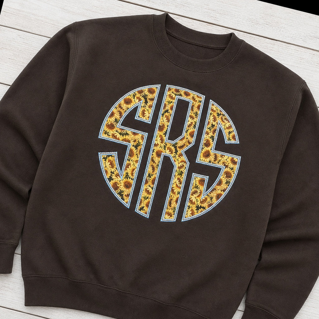 sunflower circle monogram crewneck styled flat lay