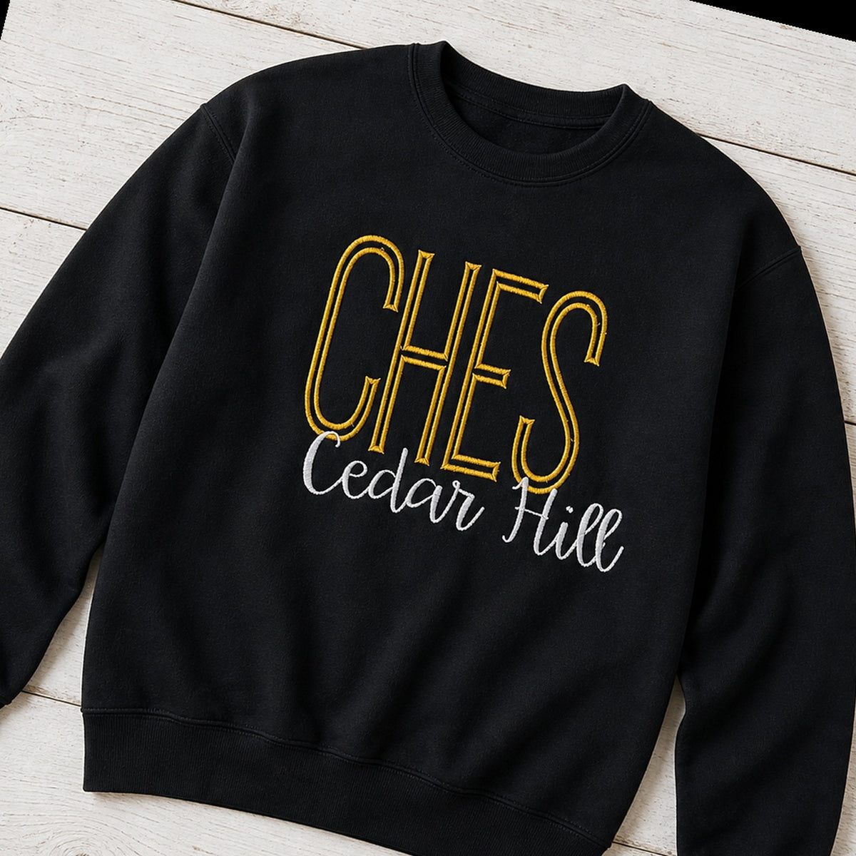 tall school initials script crewneck styled flat lay