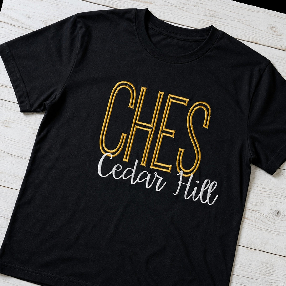 tall school initials script short sleeve styled flat lay