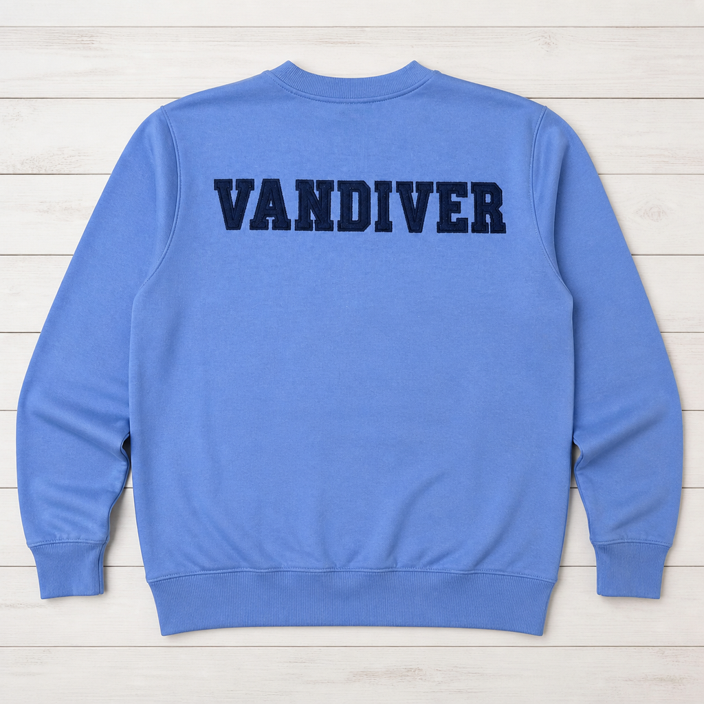 Back of cornflower blue crewneck with navy VANDIVER varsity applique
