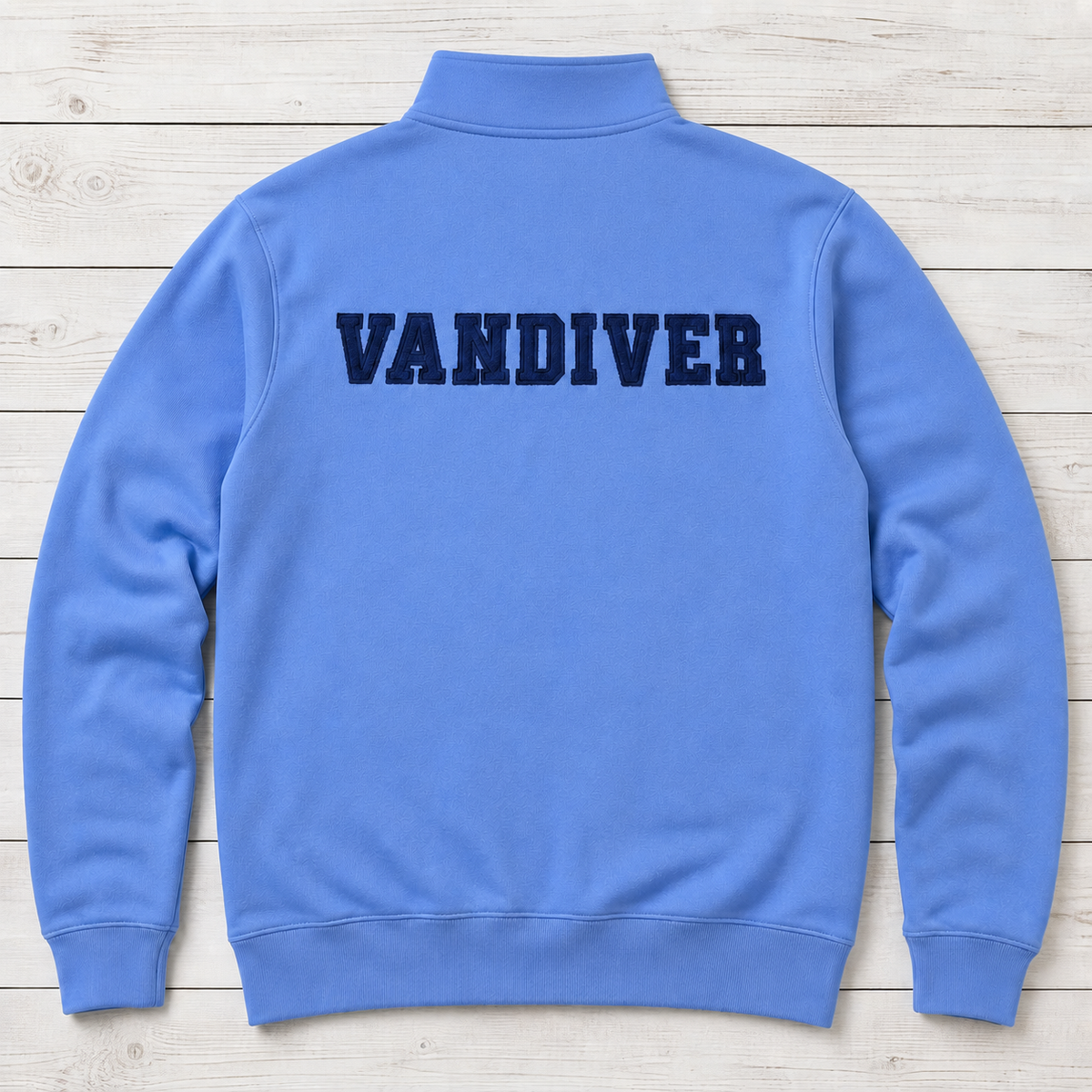Back of cornflower blue quarter-zip with navy VANDIVER varsity applique