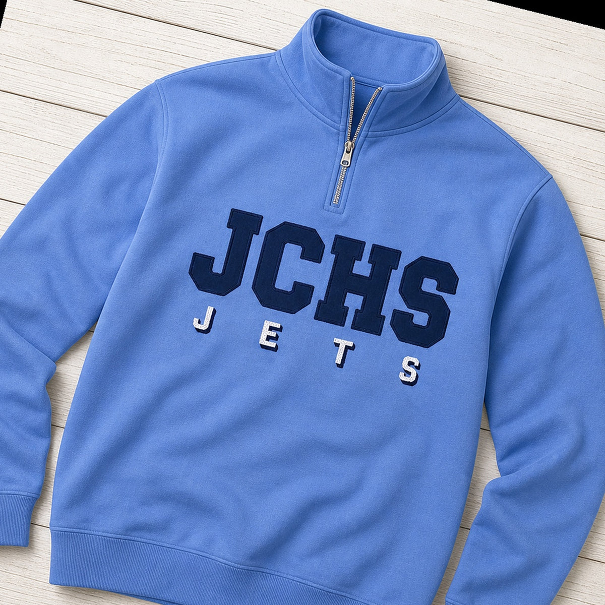 team lettering back name quarter zip styled flat lay
